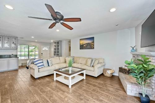 a living room with a couch and a ceiling fan at Carlsbad Charm - 3BR Stunner in Carlsbad