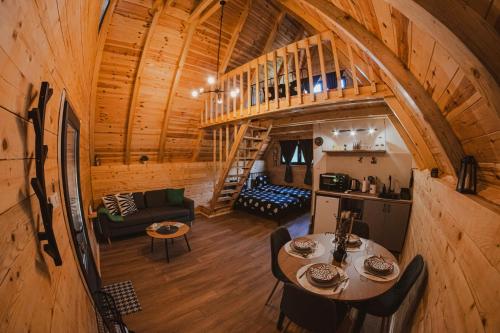 an overhead view of a living room and kitchen in a log cabin at Javorje24 chalets in Žabljak