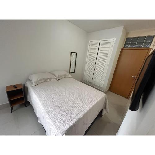 Postel nebo postele na pokoji v ubytování Apartamento Kitnet No Centro São Lourenço