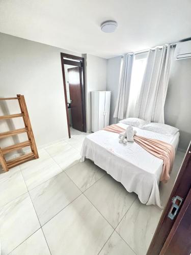 En eller flere senge i et værelse på Apartamento com Vista - Águas do Atlânticas 701