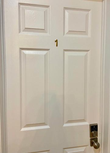 a white door with a gold door knob at Sunny House - Main Floor, Free parking, in Toronto in Toronto
