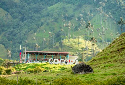a building in the middle of a grassy hill at Nueva Finca, Piscina, Jacuzzi Y Fire Pit in Alcalá