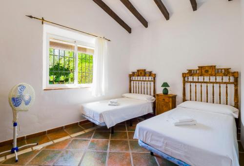 Posteľ alebo postele v izbe v ubytovaní Tu Villa Rural Olivo 3 Dormitorios Piscina privada