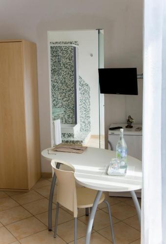 a white desk with a computer on it in a room at B&B Ore Liete in Martano