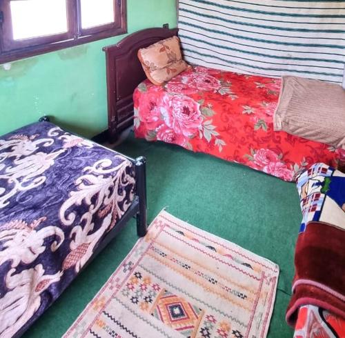 Ein Bett oder Betten in einem Zimmer der Unterkunft Atlas Imsker