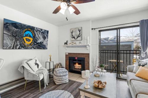 a living room with a couch and a fireplace at Cozy PC Condo - Top Floor Studio in Park City