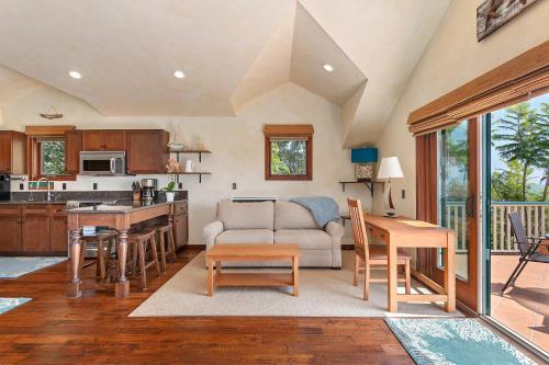 a kitchen and living room with a couch and a table at Blue Ocean View Retreat - Minutes to Beach in Summerland