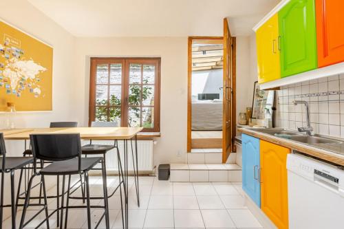 Køkken eller tekøkken på Maison du Cinquantenaire - The Residential