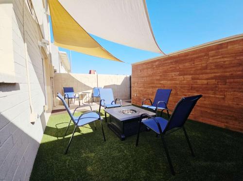 a group of chairs and a table on a patio at Osborn Oasis - Stay for 4 in Scottsdale