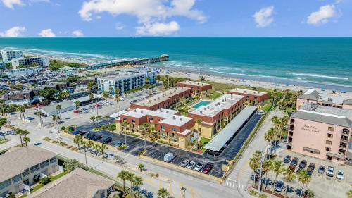 an aerial view of a city with the beach at Beachfront 2BR Condo with Pool BBQ & Steps To Beach in Cocoa Beach