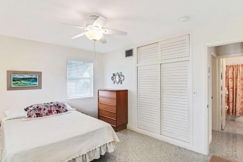a bedroom with a bed and a ceiling fan at Mango House - Immaculate 3 BDR in Boynton Beach in Boynton Beach