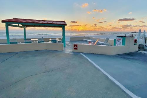 a gazebo on the roof of a building overlooking the ocean at Sea Rocket 21 in St Pete Beach