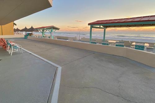 a view of a beach with chairs and tables at Sea Rocket 21 in St Pete Beach