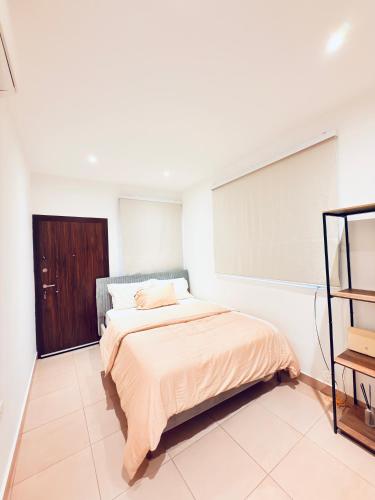 a bedroom with a bed and a window at 2 Bedroom Suite in East Legon