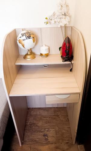 a wooden desk with a shelf and a bowl on it at Dalia Room, Paseo Durango in Durango