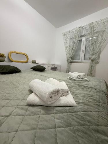 Postel nebo postele na pokoji v ubytování Apartman LENA