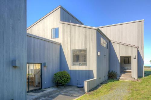 a house clad in wood and concrete at Neel Nirvana - Deck With BBQ & Community Pool in Sea Ranch