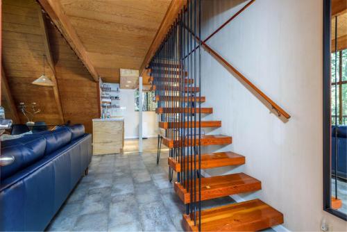 a spiral staircase in a house with wooden ceilings at Star Nest - Secluded Forest Property in Gualala