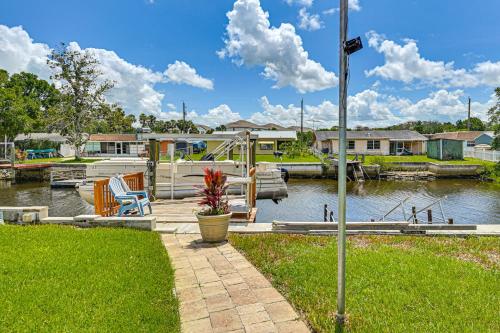 a marina with a boat on the water at Swim, Fish and Relax Port Richey Gem with Yard! in Port Richey