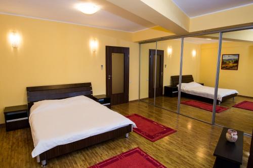 Un pat sau paturi într-o cameră la Apartment Hotel Tania Residence