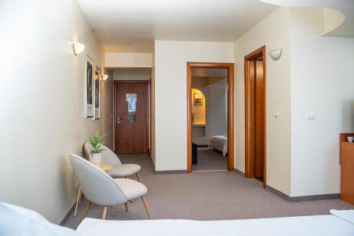 Postel nebo postele na pokoji v ubytování Excelsior Hotel Timisoara