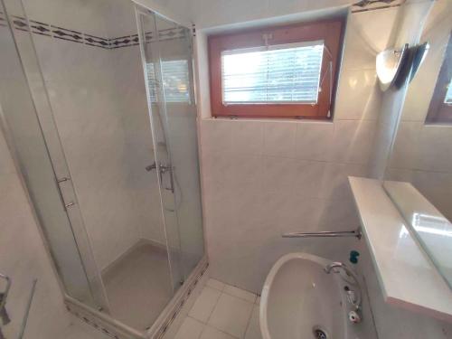 a bathroom with a shower and a sink and a toilet at Apartment in Zamardi - Balaton 33875 in Zamárdi