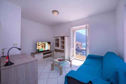 Μια τηλεόραση ή/και κέντρο ψυχαγωγίας στο Dogana Best Lake View - Happy Rentals