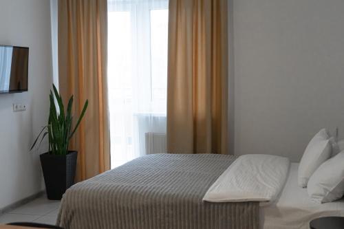 Postel nebo postele na pokoji v ubytování TREND HOUSE Apartments