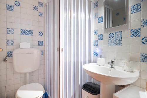 a bathroom with a toilet and a sink at Palermo - centro storico in Palermo