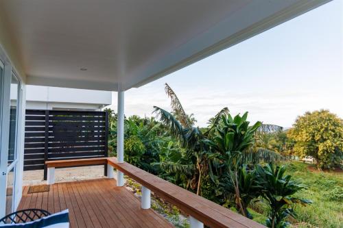 a balcony of a house with a view at Muri Ocean View Villas in Ngatangiia