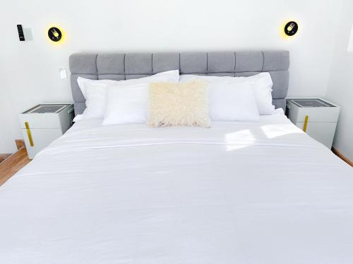 Ein Bett oder Betten in einem Zimmer der Unterkunft T Loft