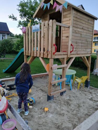 a young girl playing in a playground at Gästehaus Auszeit in Unterlamm