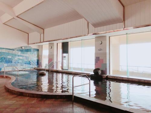 a large pool of water in a building at Hotel Aoshima Cinqmale - Vacation STAY 67416v in Miyazaki