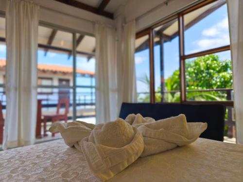 a towel on a table in a room with windows at Costa Beach in Zorritos