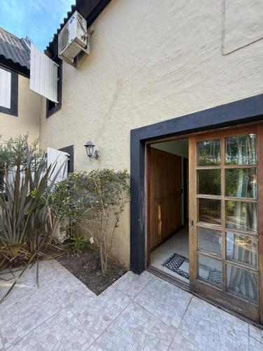 a door leading into a house with a patio at Neike Hotel Boutique in Punta del Este