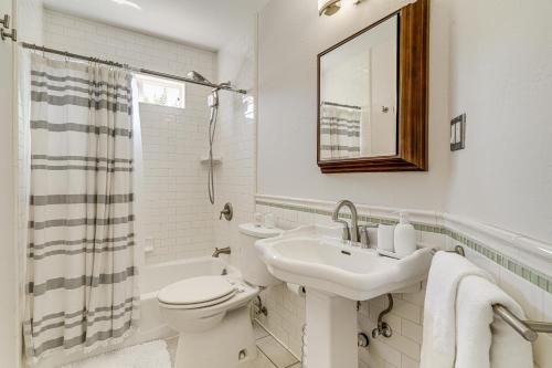 a white bathroom with a sink and a toilet at Walk to Dtwn San Jose and SJSU Charming and Cozy Gem! in San Jose