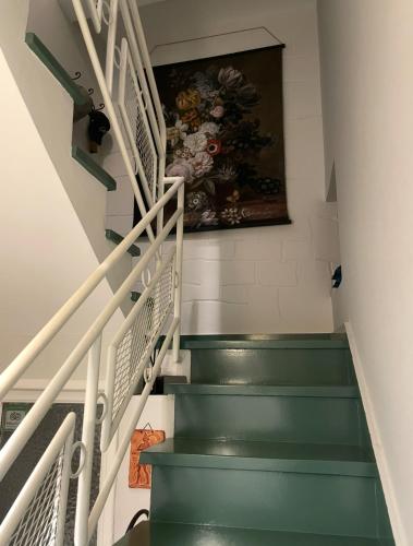 a painting on the wall next to a stairway at B&B il Vicolo in Sora