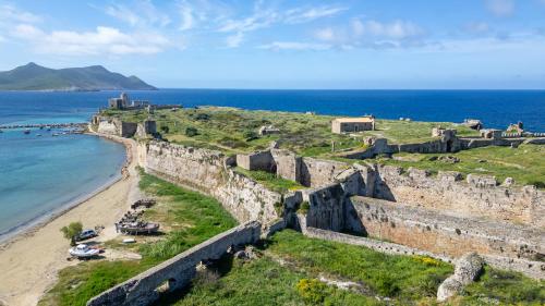 a view of the castle and the beach at Mythos Suites-Apollo apartment in Methoni