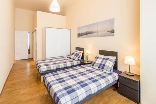 A bed or beds in a room at API Flat