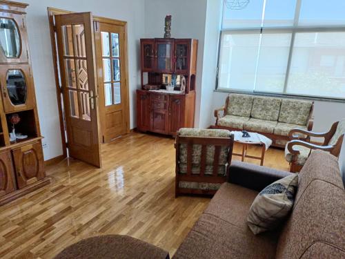 a living room with a couch and a table at A&B Apartments - Afonso in Macedo de Cavaleiros