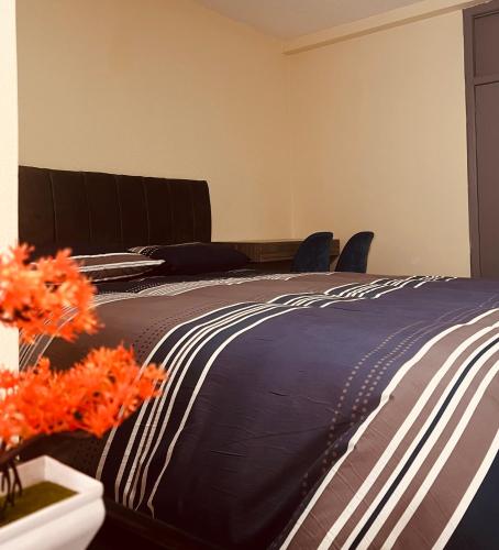 En eller flere senge i et værelse på AShostEcuador, Quito, rooms & suits, Quito cerca parque La Carolina