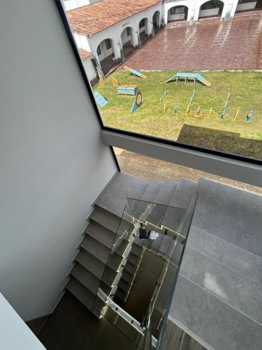 two views of a playground from the top of a building at Hospedaje Balcones de Guatavita in Guatavita
