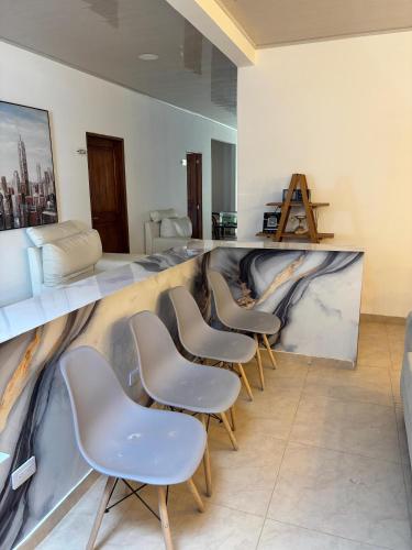 a row of chairs in a waiting room at Hotel Mevak boutique & Spa in Ciénaga de Oro
