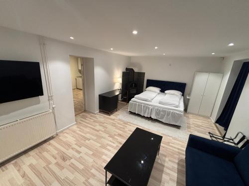 a bedroom with a bed and a flat screen tv at Nordnest, 6 min from Airport in Copenhagen