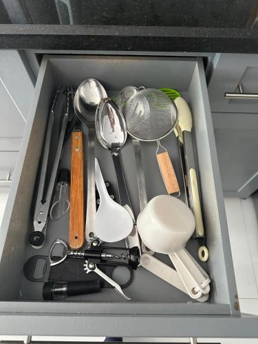 a drawer full of kitchen utensils and utensils at The Lake house 305 , Perfect Sunset in Tamiami