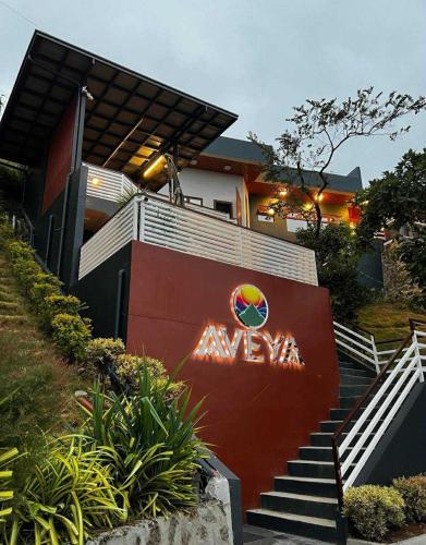 a house with a sign on the side of it at AVEYA Staycation in Tanay