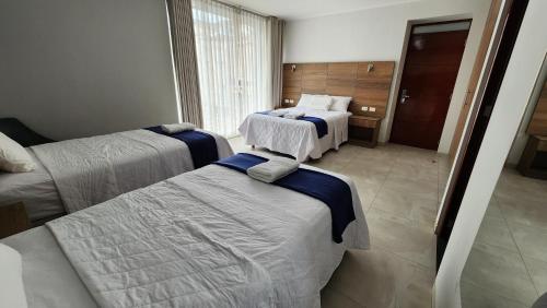Un ou plusieurs lits dans un hébergement de l'établissement Hotel CanCun