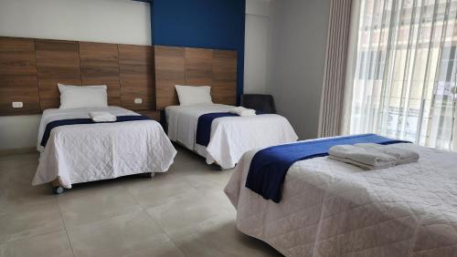 Un ou plusieurs lits dans un hébergement de l'établissement Hotel CanCun