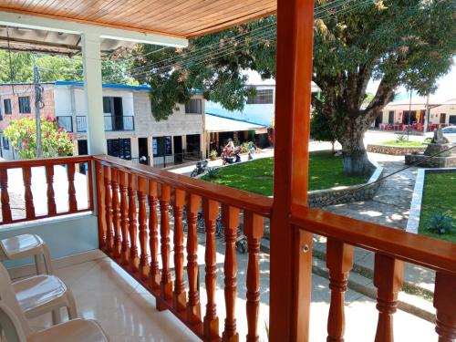 a balcony with a view of a park at Hotel El Balcon de madera in Norcasia