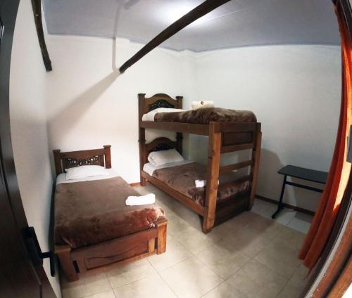 Postel nebo postele na pokoji v ubytování Ulucaho Hostel